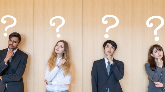 image of man, woman, man, woman standing with their hands to chin and question marks above their head (personality assessment hero)
