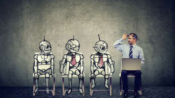 AI's Impact on Entrepreneurs hero image: 3 robots sitting on a chair looking at a human male who is scratching his head